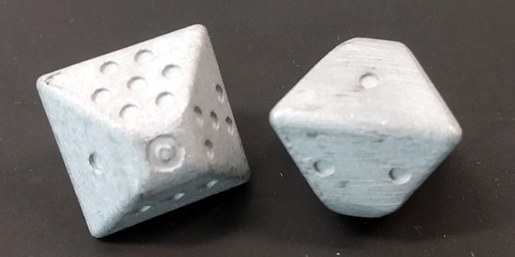 Aluminium dice as delivered from the printer.