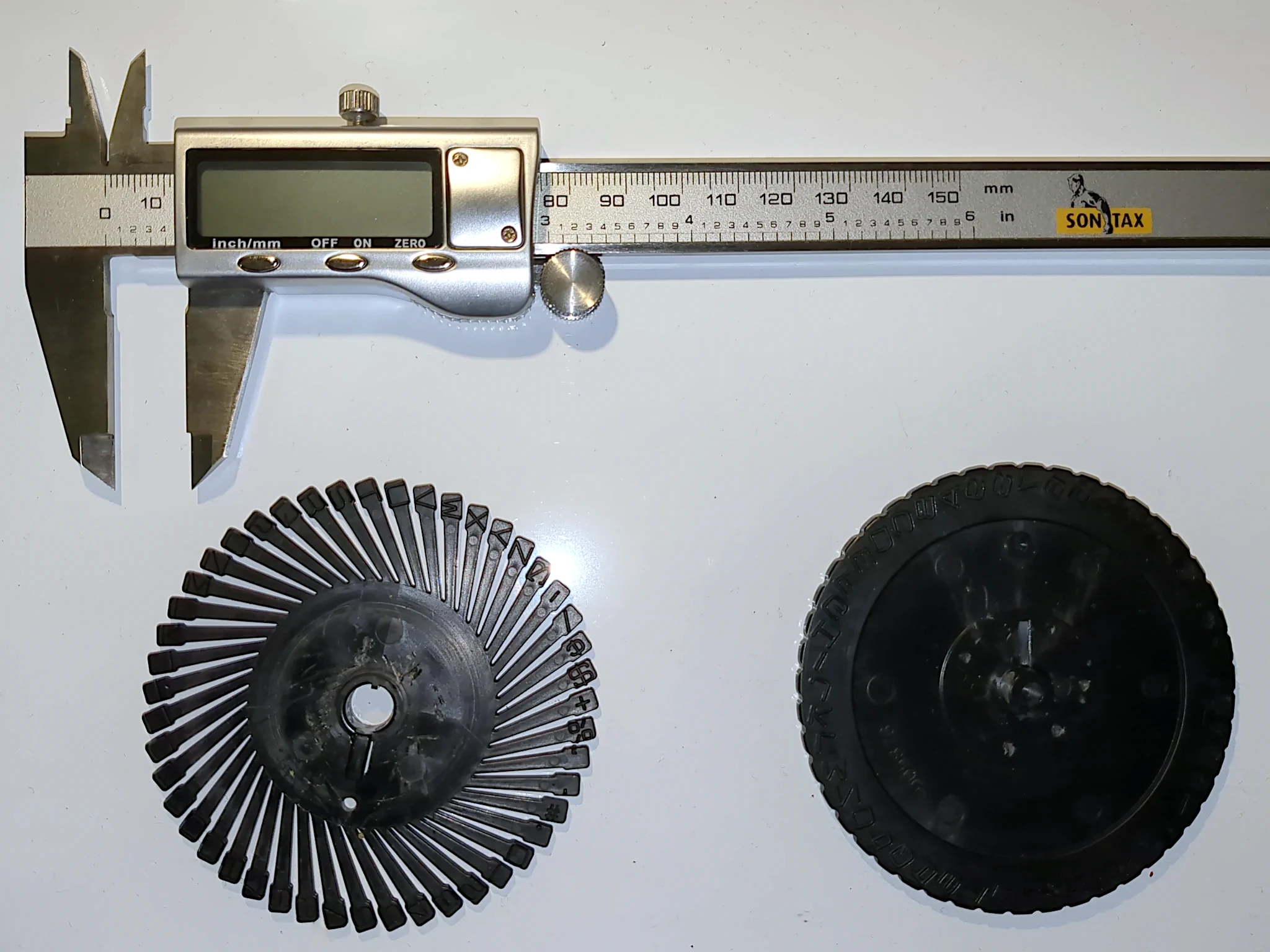Origional punch-wheel parts and my digital calipers.